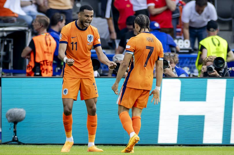 Cody Gakpo of the Netherlands celebrates with Xavi Simons.