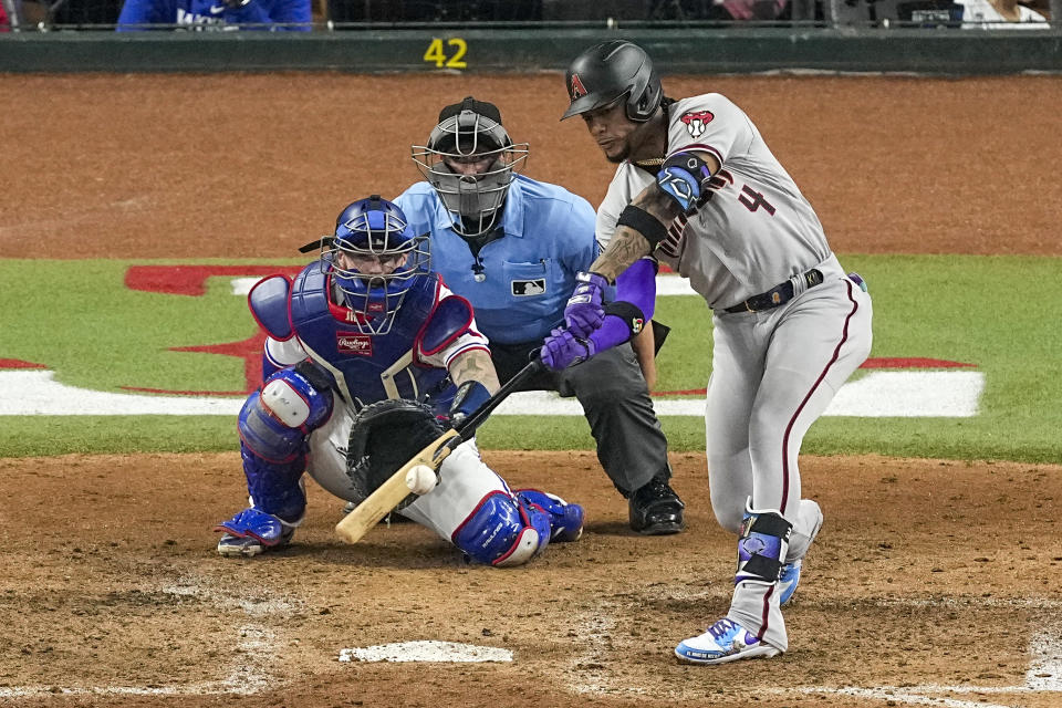 Arizona Diamondbacks' Ketel Marte hits a two-run single against the Texas Rangers during the eighth inning in Game 2 of the baseball World Series Saturday, Oct. 28, 2023, in Arlington, Texas. (AP Photo/Tony Gutierrez)