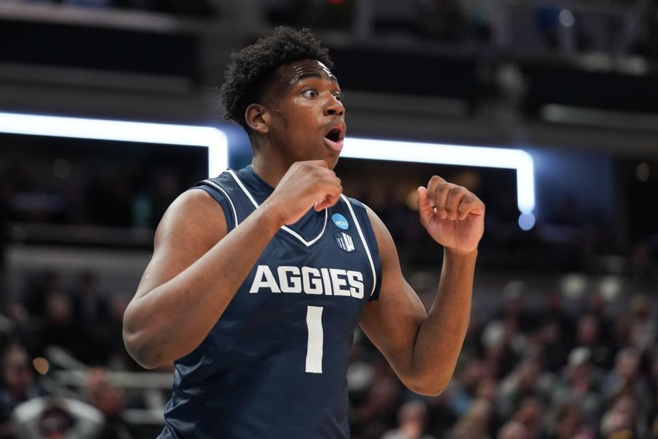 Mar 24, 2024; Indianapolis, IN, USA; Utah State Aggies forward Great Osobor (1) reacts during the first half against the Purdue Boilermakers at Gainbridge FieldHouse. Mandatory Credit: Robert Goddin-USA TODAY Sports