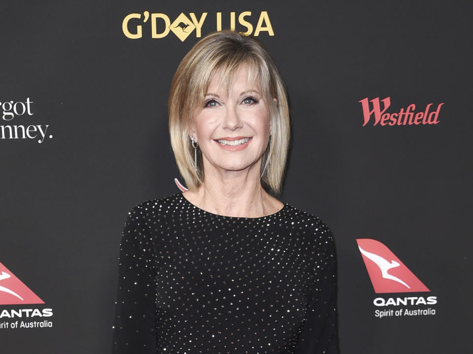FILe - In this Jan. 27, 2018 file photo, Olivia Newton-John attends the 2018 G'Day USA Los Angeles Gala at the InterContinental Hotel Los Angeles. Newton-John says she has been diagnosed with cancer for the third time in three decades. The four-time Grammy winner, who will turn 70 on Sept. 26, told Australian news program “Sunday Night” doctors found a tumor in her lower back in 2017. (Photo by Richard Shotwell/Invision/AP, File)
