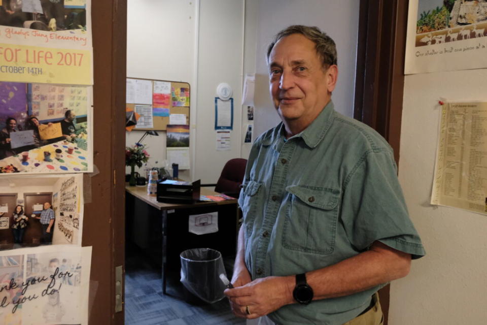 Jim Biela, an itinerant social worker for the Lower Kuskokwim School District, sits in his office on Oct. 9 in Bethel. (Claire Stremple/Alaska Beacon)