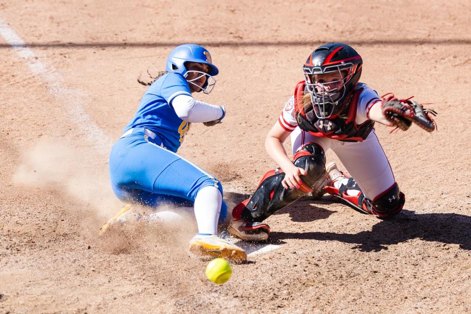 UCLA’s Maya Brady (7) slides into home during an NCAA softball game between Utah and UCLA at Dumke Family Softball Stadium in Salt Lake City on April 29, 2023.