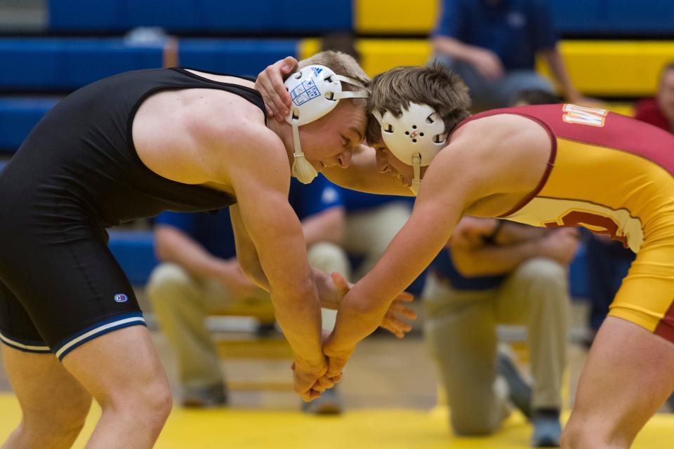 Mater Dei's Nathan Critchfield (right) pinned Memorial's Kelton Farmer in 3:34 to win the 220-pound division title on Saturday at the SIAC wrestling meet at Castle. Critchfield improved to 23-0.