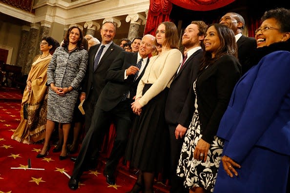 U.S. Sen. Kamala Harris (D-Calif.), second from left, accompanied by her family, participates in a re-enacted swearing-in with U.S. Vice President Joe Biden in the Old Senate Chamber at the U.S. Capitol on Jan. 3, 2017 in Washington, D.C.