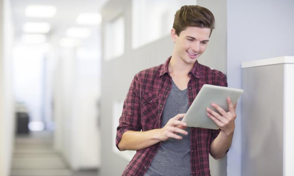 Businessman using digital tablet in office