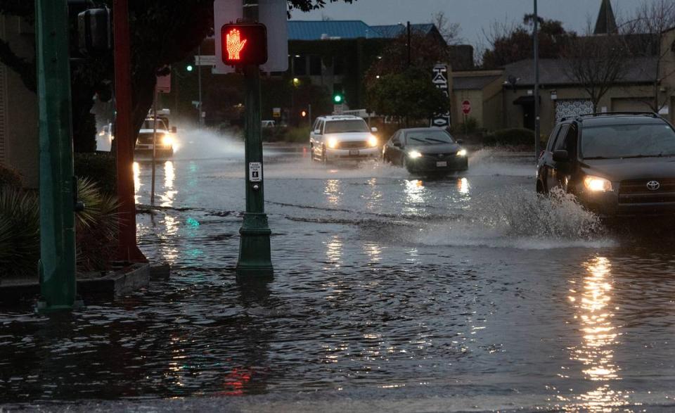 Needham Street at College Ave was overwhelmed by rain water in Modesto, Calif., Saturday, Dec. 10, 2022.