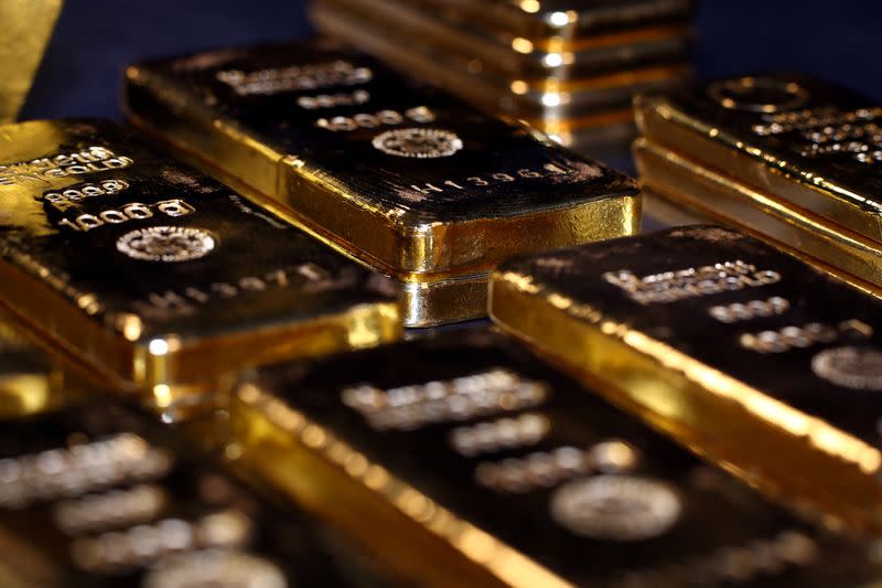 FILE PHOTO: Gold bars and coins are stacked in the safe deposit boxes room of the Pro Aurum gold house in Munich