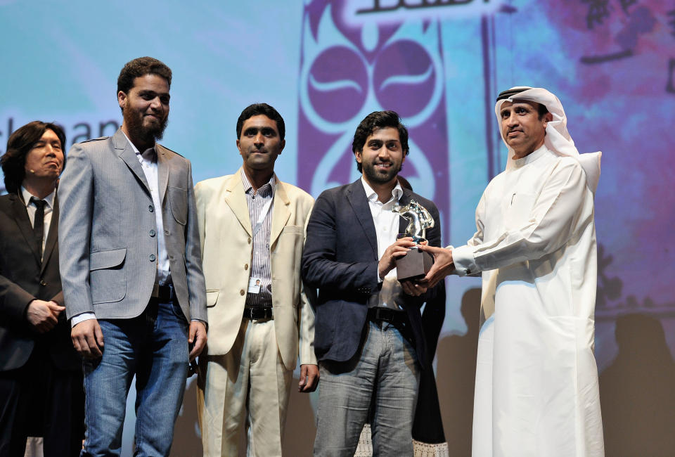 DUBAI, UNITED ARAB EMIRATES - DECEMBER 16: Producer Musa Sayeed (second right) with Muhr AsiaAfrica Feature Special Jury Prize award during the Closing Ceremony on day eight of the 9th Annual Dubai International Film Festival held at the Madinat Jumeriah Complex on December 16, 2012 in Dubai, United Arab Emirates. (Photo by Gareth Cattermole/Getty Images for DIFF)