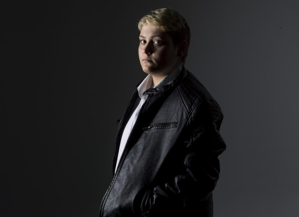 Matteo Coccimiglio poses for a portrait in Rome, Wednesday, March 24, 2021. Matteo is an 18-year-old student who identifies as a man and is in the process of changing his legal gender from female to male. The Ripetta school of art in Rome - where he studies - recently joined a handful of high schools in Italy that give transgender students the right to be known by a name other than the one they were given at birth. The initiative is meant to create an environment where transgender students feel secure and reflects a growing awareness in Italy of gender dysphoria among teenagers and children. (AP Photo/Alessandra Tarantino)