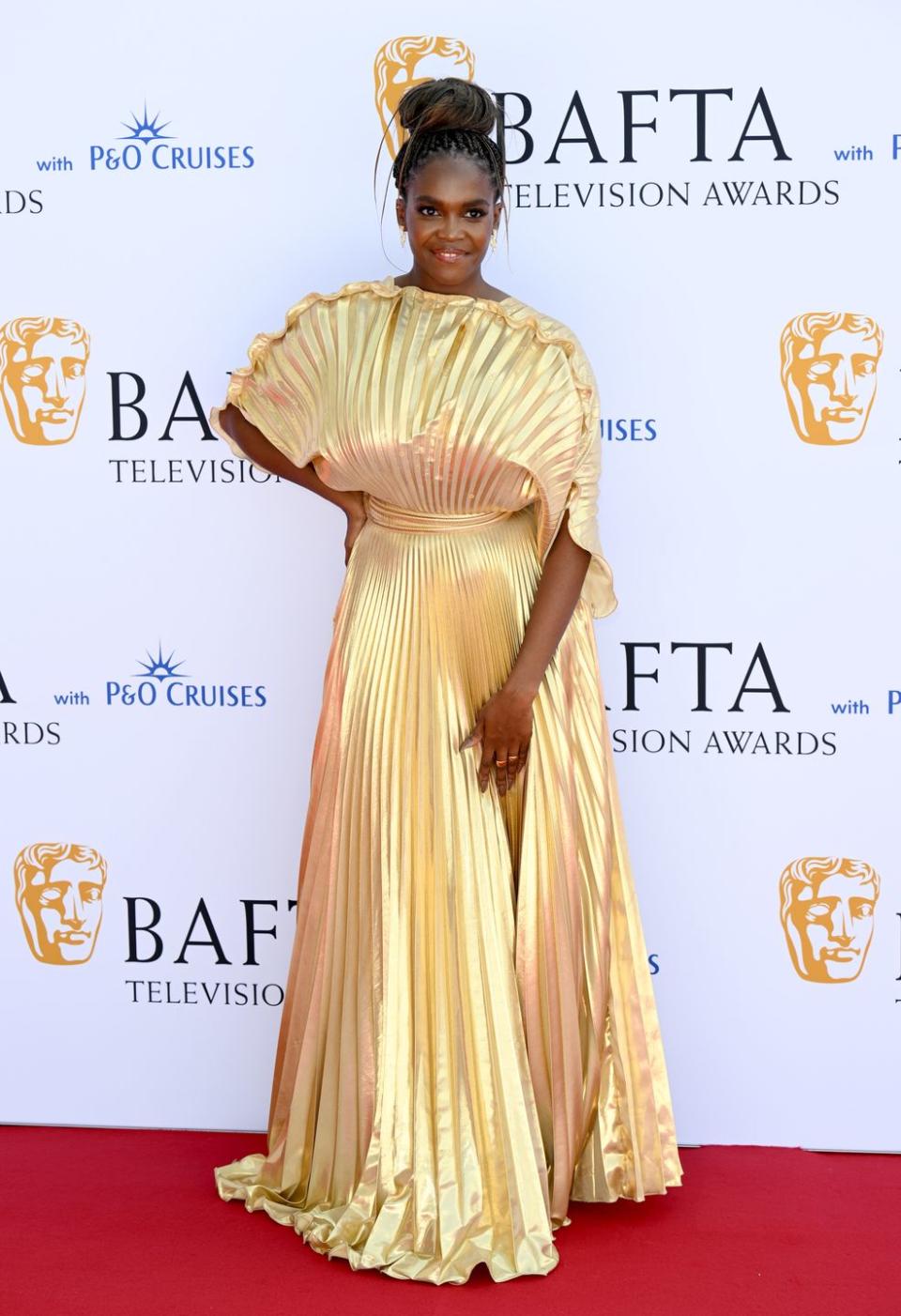 <p>Oti Mabuse channeled old Hollywood glamour in a stunning gold pleated dress as she attended the awards.</p>