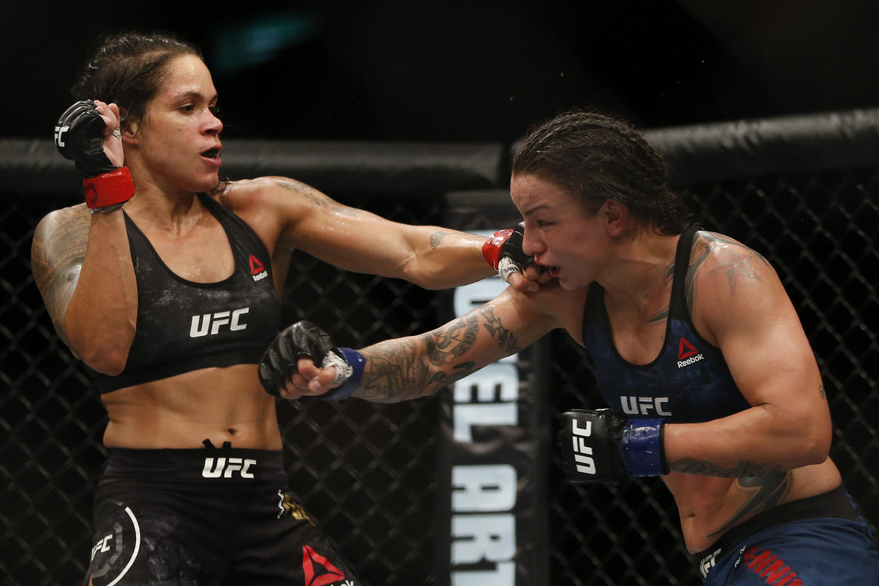 Amanda Nunes, left, fights Raquel Pennington during their UFC women’s bantamweight mixed martial arts bout in Rio de Janeiro, Brazil, on May 13, 2018. (AP Photo/Leo Correa)