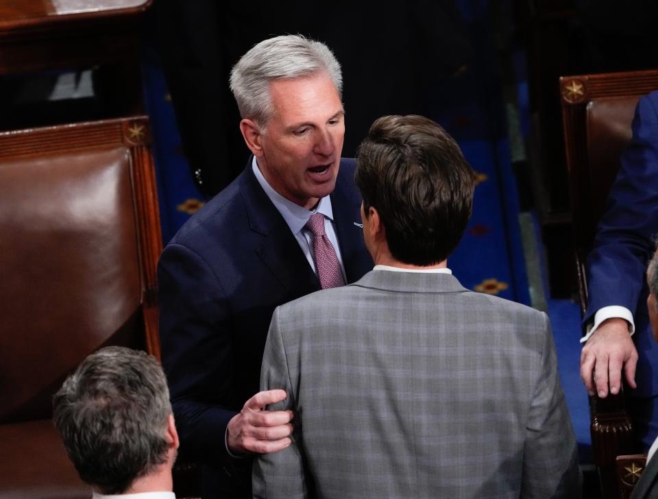 Kevin McCarthy (R-Calif.) talks to Matt Gaetz (R-Fla.) during a session of the House of Representatives on Friday, Jan. 6, 2023.