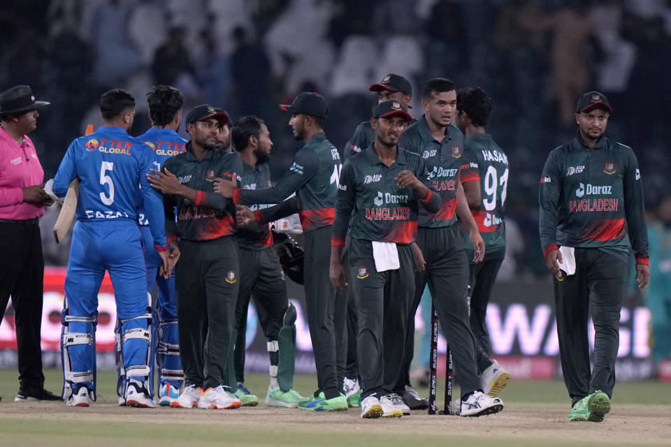 Bangladesh's players shake hand with Afghanistan's players after winning the Asia Cup cricket match against Afghanistan in Lahore, Pakistan, Sunday, Sept. 3, 2023. (AP Photo/K.M. Chaudary)