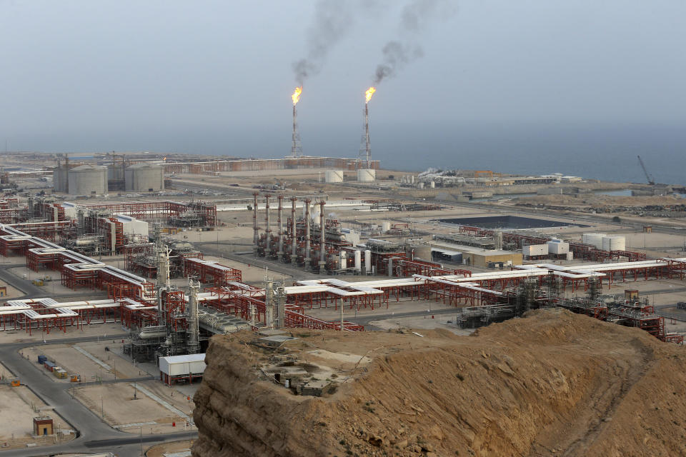 FILE - This March 16, 2019 file photo, shows natural gas refineries at the South Pars gas field on the northern coast of the Persian Gulf, in Asaluyeh, Iran. China's state oil company has pulled out of a $5 billion deal to develop a portion of Iran's massive offshore natural gas field, the Islamic Republic's oil minister said Sunday, Oct. 6, 2019, an agreement from which France's Total SA earlier withdrew over U.S. sanctions. (AP Photo/Vahid Salemi, File)