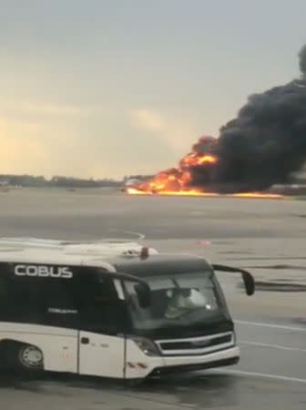 A Sukhoi passenger plane is engulfed in flames after it made an emergency landing due to an onboard fire at Sheremetyevo International Airport, outside Moscow, Russia May 5, 2019. Mikhail Norenko via REUTERS