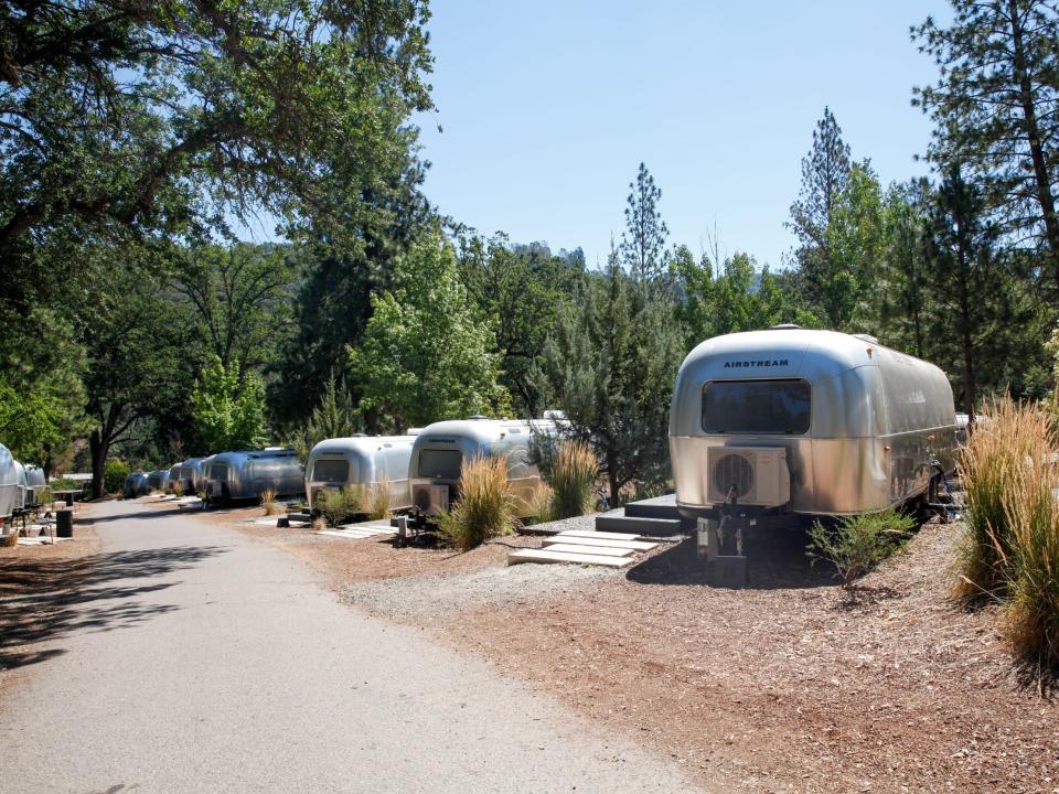 Autocamp Yosemite's Airstream suites by a walkway.