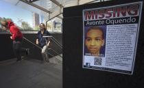 A poster for Avonte Oquendo, a missing 14-year-old autistic child, is posted at the South Ferry subway stop in New York, October 12, 2013. According to local media, all work on the subways was suspended last night and all crews were tasked with the job of finding Oquendo, who has been missing since he was videotaped walking out of his school in Queens on October 4. Oquendo is mute and has a fascination with trains, his family said. (REUTERS/Carlo Allegri)