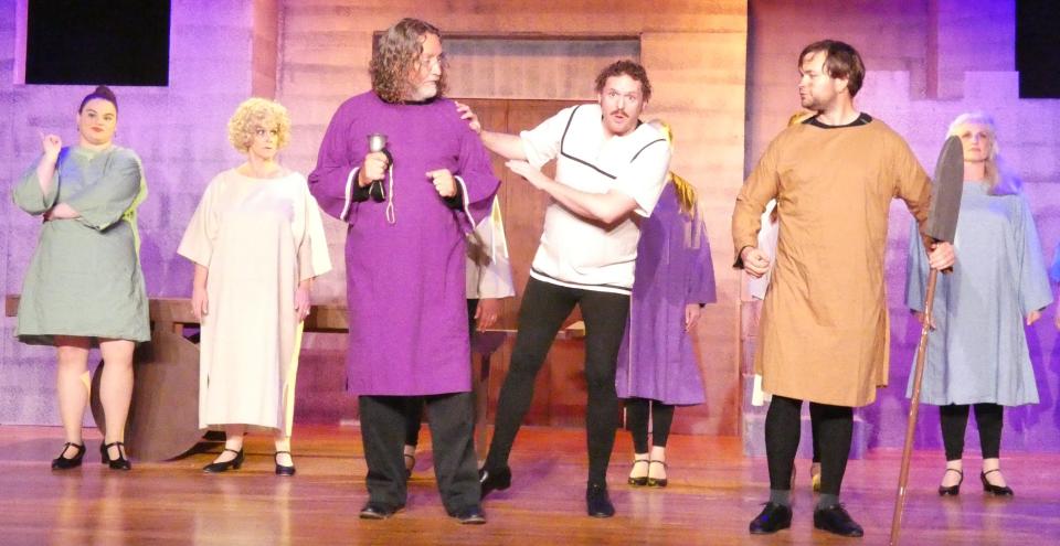 Randy Mann, Eric Julian Walker and Jonathan Noggle, from left, rehearse a scene from Bucyrus Little Theatre's production of "Monty Python's Spamalot" on Monday.