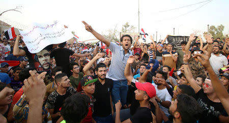 People shout slogans during a protest near the main provincial government building in Basra, Iraq, July 20, 2018. REUTERS/Essam al-Sudani