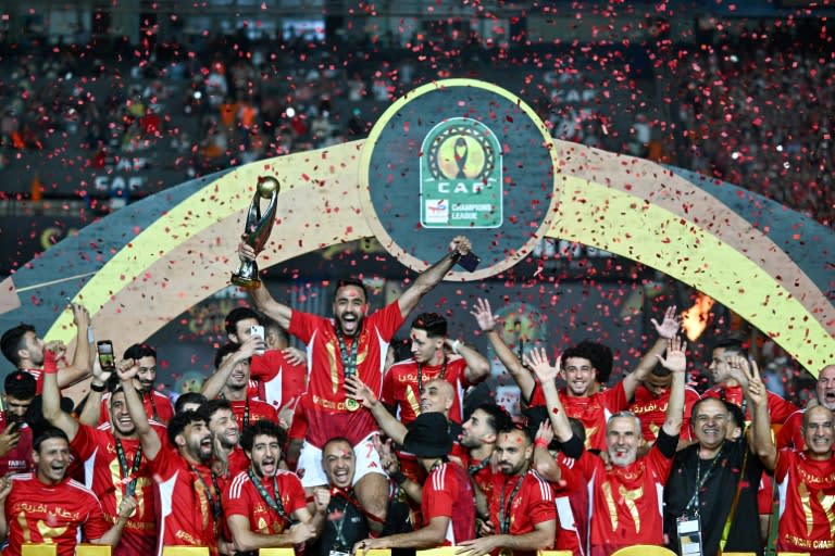 Al Ahly of Egypt players celebrate in Cairo after defeating Esperance of <a class="link " href="https://sports.yahoo.com/soccer/teams/tunisia/" data-i13n="sec:content-canvas;subsec:anchor_text;elm:context_link" data-ylk="slk:Tunisia;sec:content-canvas;subsec:anchor_text;elm:context_link;itc:0">Tunisia</a> in the 2024 CAF Champions League final. (Khaled DESOUKI)