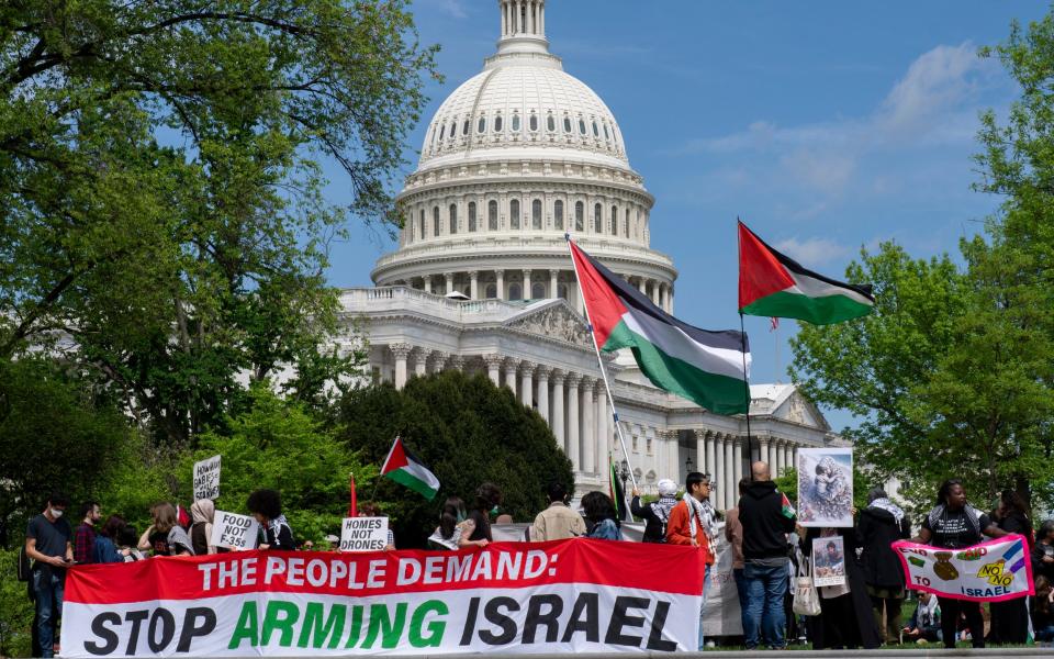 Pro-Palestinian activists demonstrate outside the Capitol in Washington as the House prepared to vote on approval of $95 billion in foreign aid for Ukraine, Israel and other US allies