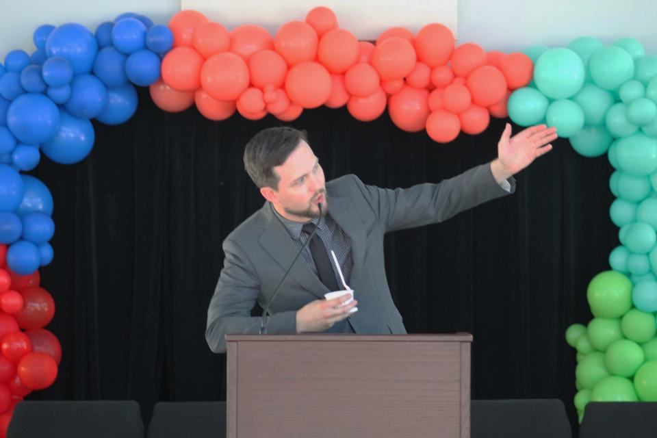 Savannah Repertory Theatre executive director Ryan McCurdy speaks with the crowd during a groundbreaking on Wednesday, June 15, at their new space on Broughton Street.