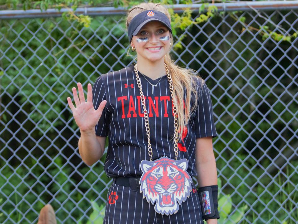 Taunton's Brooke Aldrich poses while wearing the "home run chain" after hitting a three run home run against Methuen in the Division 1 Elite Eight.