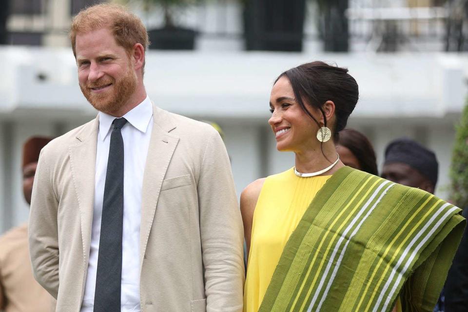 <p>KOLA SULAIMON/AFP via Getty</p> From Left: Prince Harry and Meghan Markle at the State Governor House in Lagos, Nigeria on May 12, 2024.