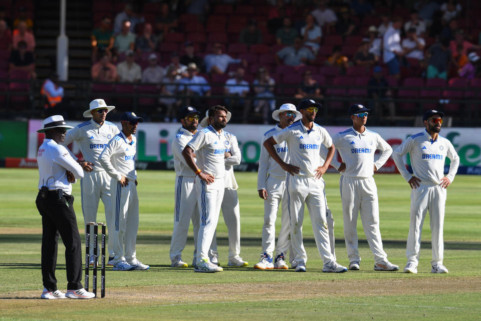 India players look at the digital screen.