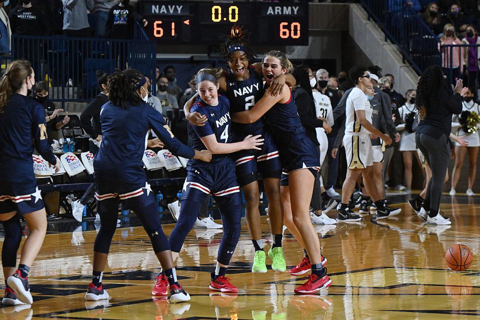 Navy women celebrate 61-60 victory over Army in Patriot League game Saturday in Annapolis, Maryland. PHIL HOFFMANN/For Navy Athletics