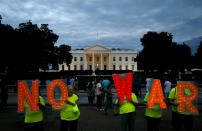 Protesters hold signs spelling out, "No War," outside the White House, Thursday June 20, 2019, in Washington, after President Donald Trump tweeted that "Iran made a very big mistake" by shooting down a U.S. surveillance drone over the Strait of Hormuz in Iran. (AP Photo/Jacquelyn Martin)