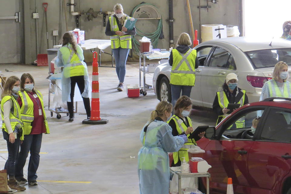 This 2020 photo provided by Carlton County shows their drive-thru flu clinic in Carlton, Minn. The facility is a way to social distance in the coronavirus pandemic, but also served as a test run for the COVID-19 vaccines that county health officials still know little about. (Jared Hovi/Carlton County GIS via AP)