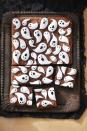 <p>Kids will love piping the friendly marshmallow ghosts on top of these brownies. </p><p>Get the <a href="https://www.countryliving.com/food-drinks/a28943165/marshmallow-ghost-brownies-recipe/" rel="nofollow noopener" target="_blank" data-ylk="slk:Marshmallow Ghost Brownies recipe;elm:context_link;itc:0;sec:content-canvas" class="link "><strong>Marshmallow Ghost Brownies recipe</strong></a> from Country Living.</p>