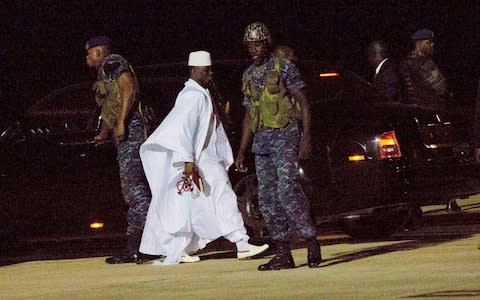 Former Gambia's leader Yahya Jammeh departs at Banjul airport in Gambia in January 2017