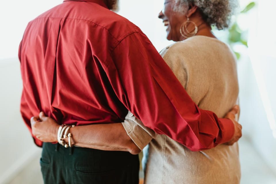 a couple holding each other