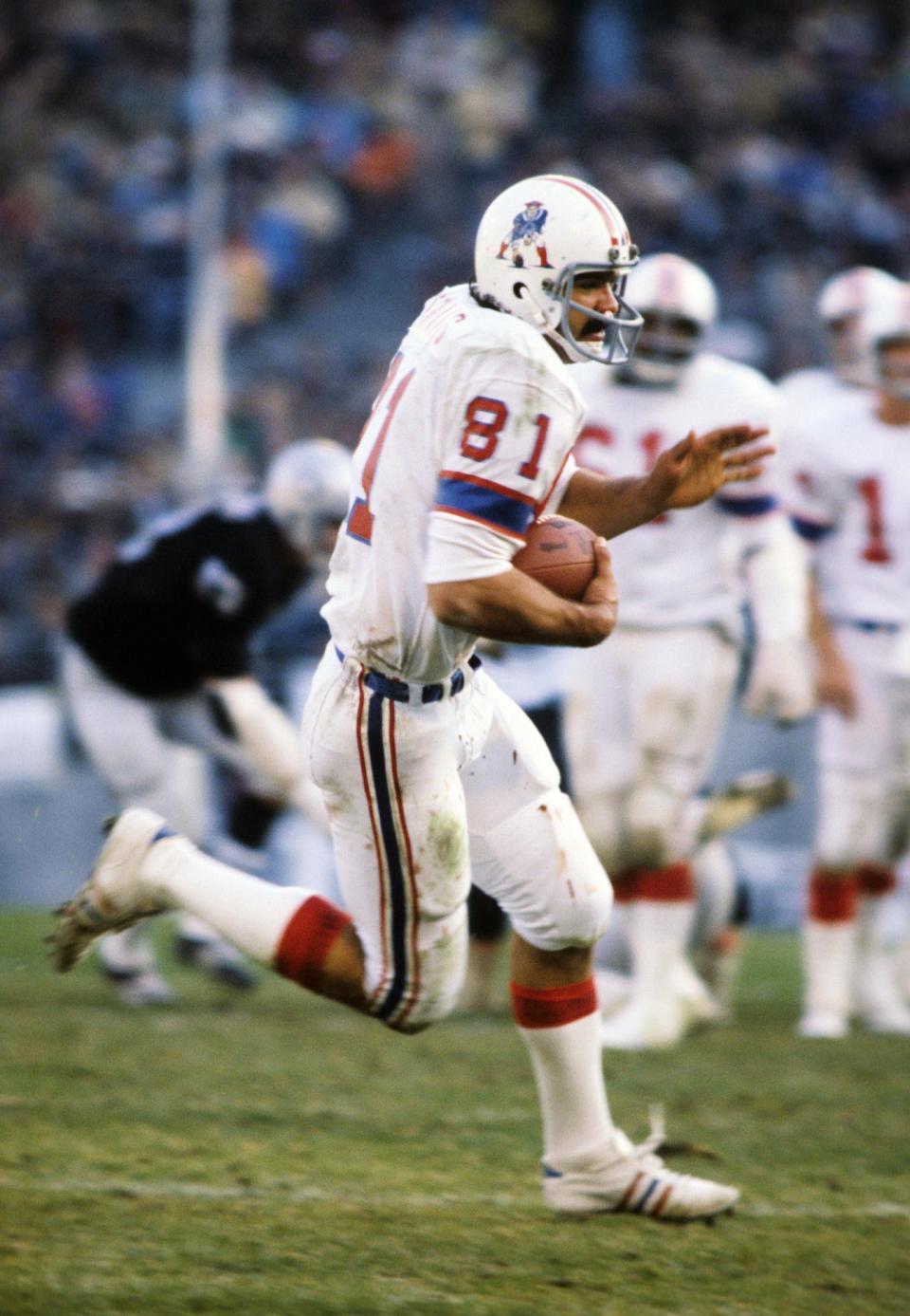 New England Patriots tight end Russ Francis catches a pass against the Oakland Raiders in a 1976 AFC divisional playoff game.