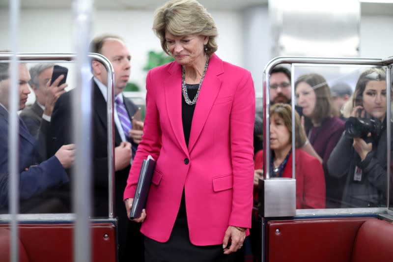 U.S. Senator Murkowski speaks to reporters as she transits the subway under the U.S. Capitol in Washington