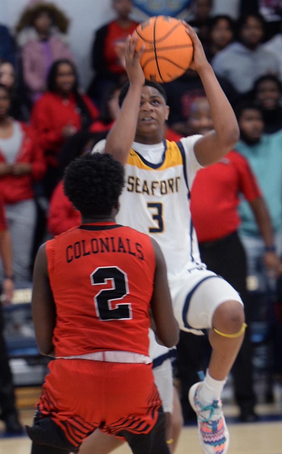 Seaford's Kashmier Wise shoots over Michael Wilmore of William Penn.