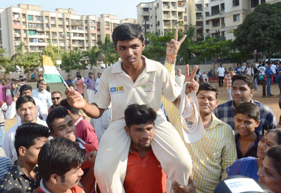 MUMBAI, INDIA - JANUARY 05: Pranav Dhanawade is greeted by friends upon his rare record on January 5, 2016 in Mumbai, India. 

Mumbai teenager Pranav Dhanawade, who has broken a century-old cricketing record on Monday, became the first batsman to score 1000-plus runs in an innings in any form of cricket. Batting against Arya Gurukul School in a Bhandari Cup match, Pranav reached 1000 runs in just 323 balls on Tuesday. The tournament is an under-16 inter-school event organised by the Mumbai Cricket Association (MCA) mainly for the benefit of suburban schools.

PHOTOGRAPH BY Barcroft India

UK Office, London.
T +44 845 370 2233
W www.barcroftmedia.com

USA Office, New York City.
T +1 212 796 2458
W www.barcroftusa.com

Indian Office, Delhi.
T +91 11 4053 2429
W www.barcroftindia.com (Photo credit should read Barcroft India / Barcroft Media via Getty Images)