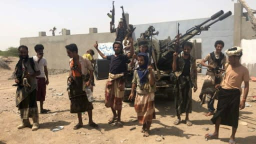 Yemeni pro-government forces backed by United Arab Emirates troops gather on the outskirts of the rebel-held port city of Hodeida on June 18, 2018 in readiness to advance into the city's battleground airport