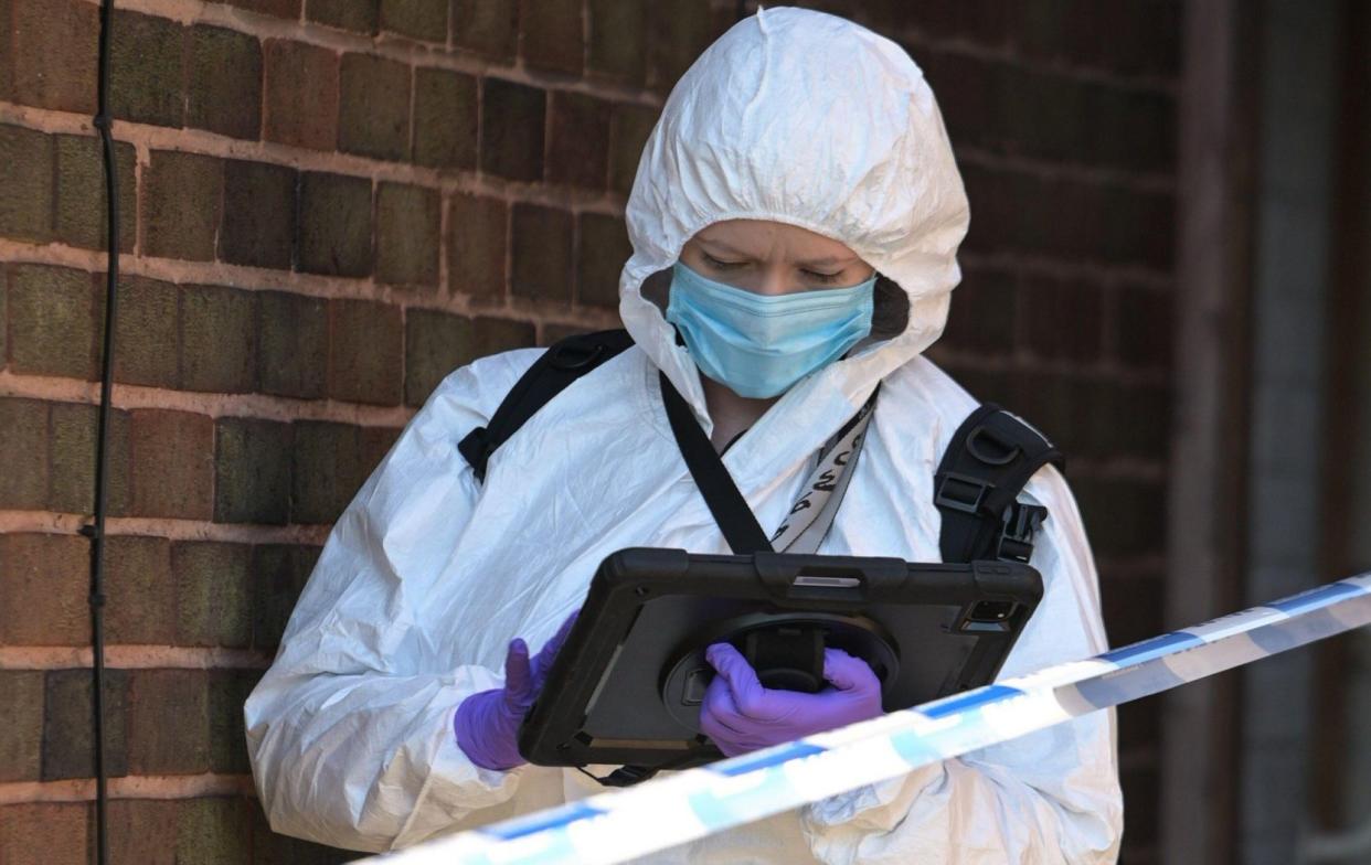 Forensics officer works at the scene