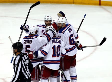 New York Rangers players celebrate a goal by New York Rangers left wing Rick Nash (61) during the third period in game six of the Eastern Conference Final of the 2015 Stanley Cup Playoffs at Amalie Arena. Mandatory Credit: Reinhold Matay-USA TODAY Sports