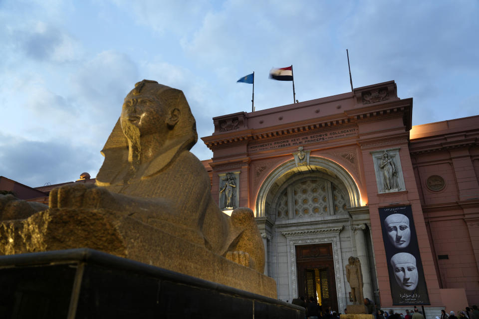 Egyptian and European flags fly over the Egyptian museum in Cairo, Egypt, Monday, Feb. 20, 2023. Egypt's ministry of tourism and antiquities unveiled a renovated wing within its 120-year-old museum, the first stage of a broader replenishment program for the palatial building. (AP Photo/Amr Nabil)