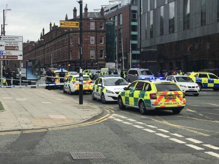 Manchester hotel attack: Armed police swarm Hilton in Deansgate after woman's throat slashed