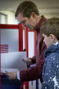 Kentucky Attorney General and Democratic Gubernatorial candidate Andy Beshear studies his ballot at the Knights of Columbus polling location Tuesday, Nov. 5, 2019, in Louisville, Ky. (AP Photo/Bryan Woolston)