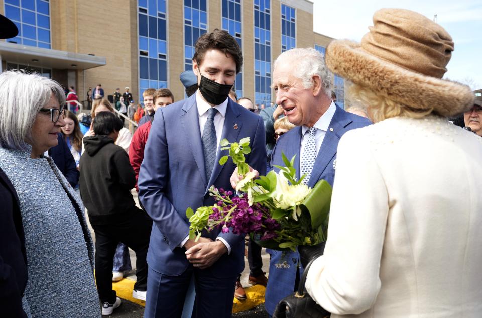 Prince Charles and Camilla, Duchess of Cornwall greet Canada's Gov.-Gen. Mary Simon as Prime Minister Justin Trudeau looks on, in St. John's, during the start a three-day Royal Canadian tour, Tuesday, May 17, 2022. (Paul Chiasson/The Canadian Press via AP)