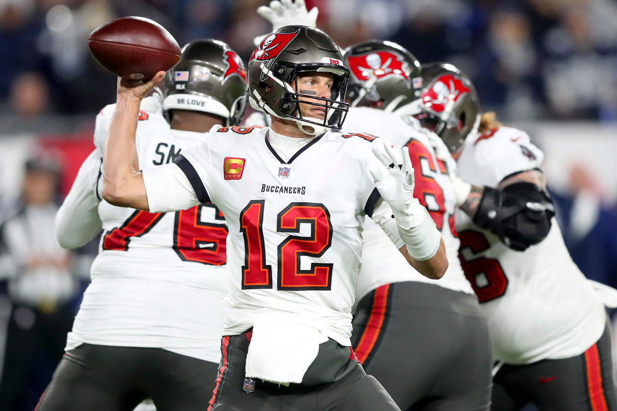 TAMPA, FL - JANUARY 16: Tampa Bay Buccaneers quarterback Tom Brady (12) throws a pass during the NFC Wild Card Playoff game between the Dallas Cowboys and the Tampa Bay Buccaneers on January 16, 2023 at Raymond James Stadium in Tampa, Florida. (Photo by Cliff Welch/Icon Sportswire via Getty Images)