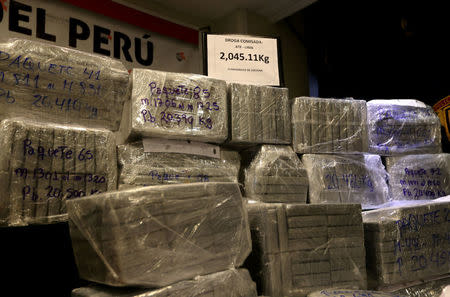 Peruvian police display to the press more than two toes of cocaine hidden in packages of asparagus destined for Amsterdam, after arresting a Serbian man and four Peruvians suspected of running a smuggling operation from a gourmet food business, authorities said, at police headquarters in Lima, Peru, January 12, 2017. REUTERS/Mariana Bazo