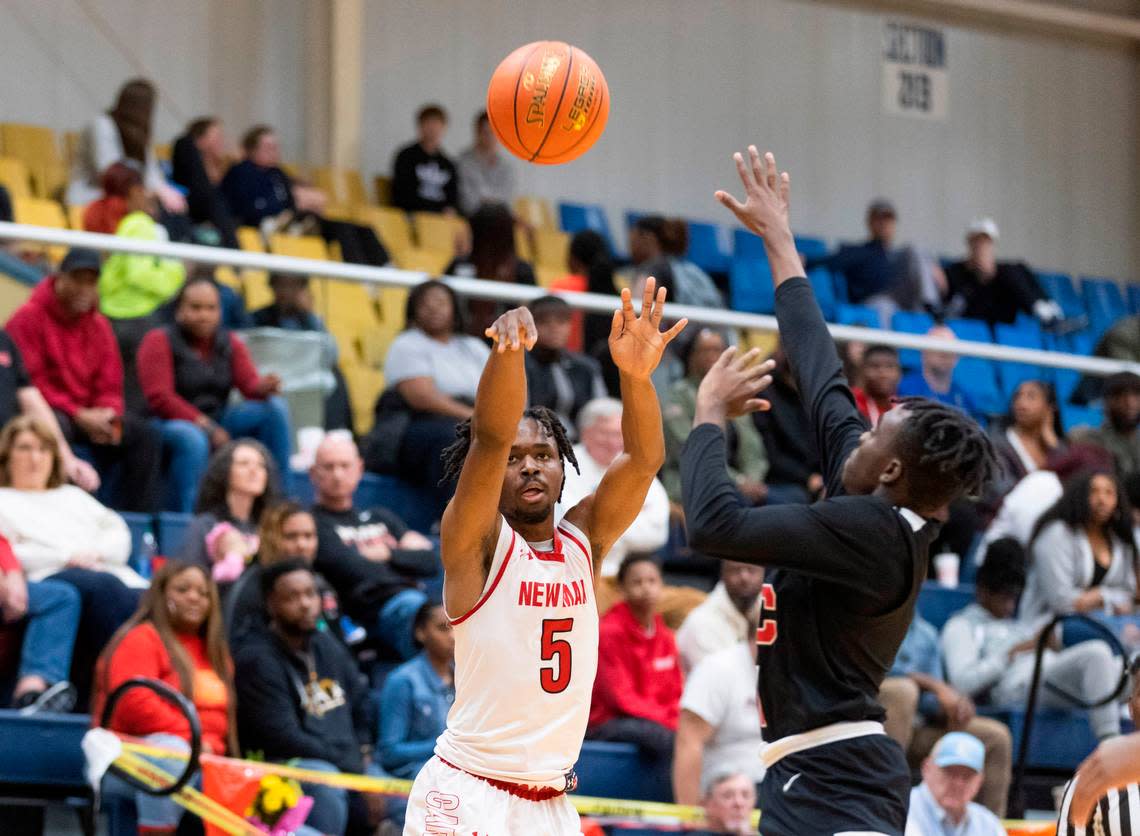 Jordan Frazier (5) of Cardinal Newman puts up a shot during Cardinal Newman’s game against Augusta Christian at the Sumter County Civic Center in Sumter on Saturday, February 25, 2023.