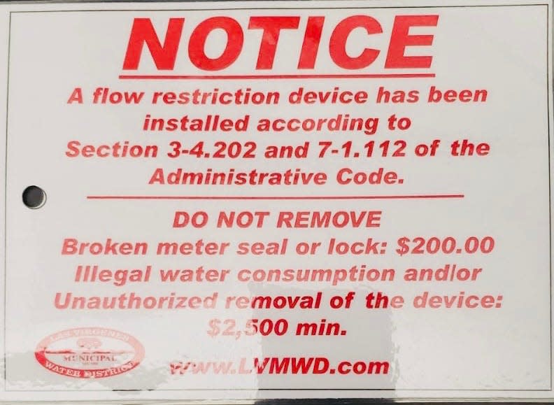 The picture is part of the 'seal' that goes on water meters when flow restrictors are installed at homes with excessive water use in Las Virgenes, Calif. If the seal removed or tampered with, the flow-restrictor penalty time is extended to 30 days, with penalties escalating for repeat offenders.